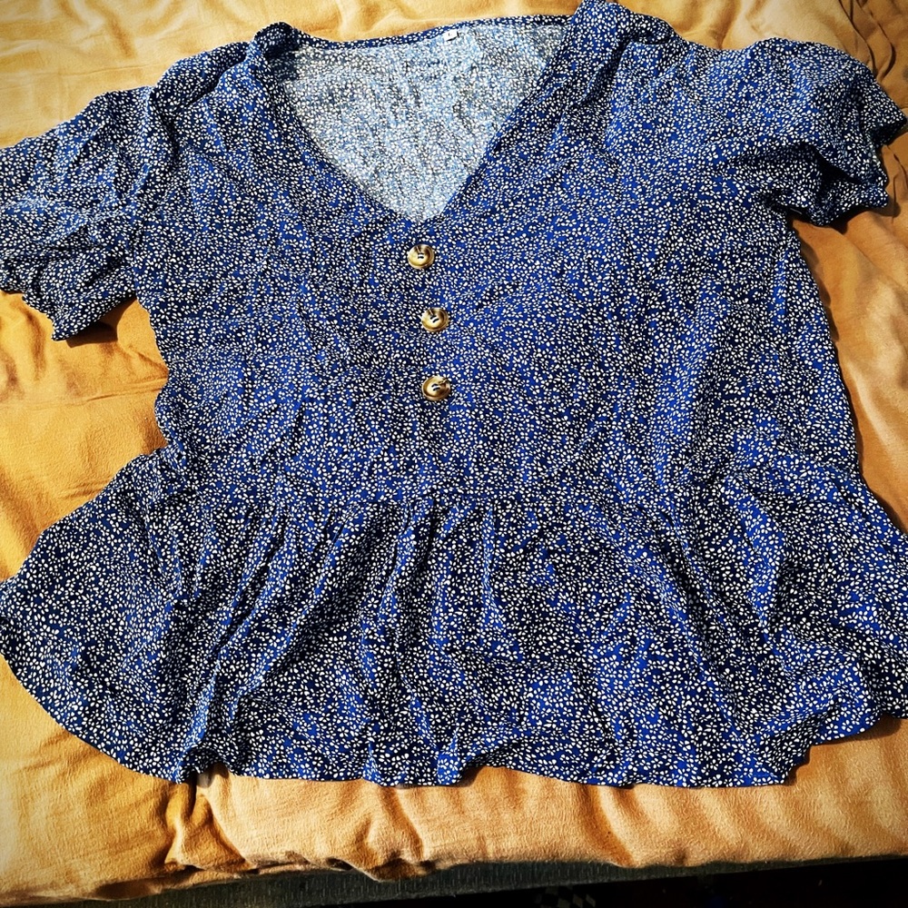 Women’s SHEIN blue top with white floral design